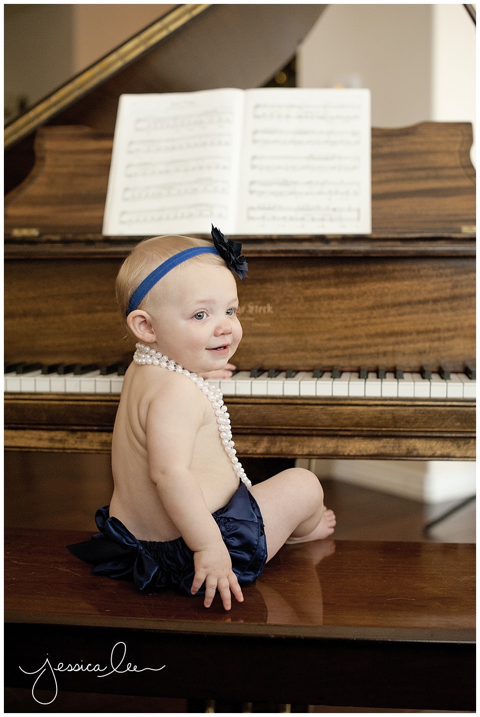newborn photographers Broomfield, 1 year old at piano