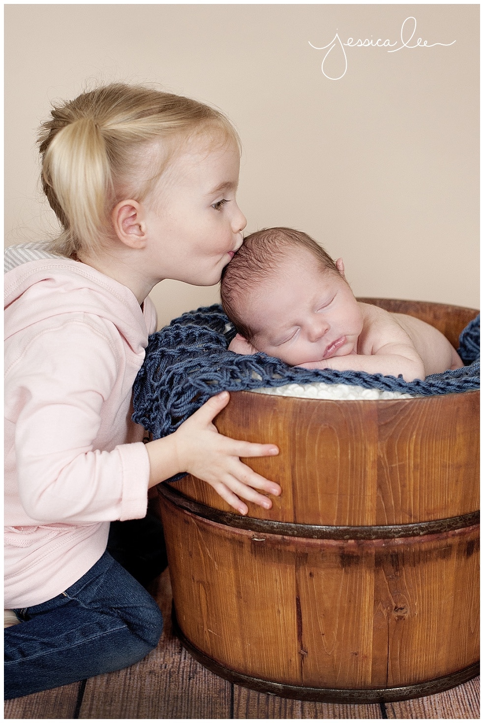 baby photography boulder, big sister kissing baby brother