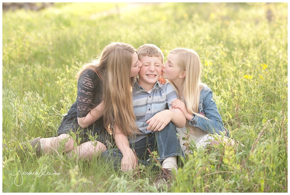 Boulder Family Photographer, sisters kissing brothers cheeks