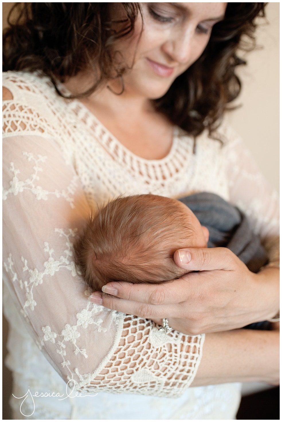 newborn photographer broomfield, mom cuddling newborn