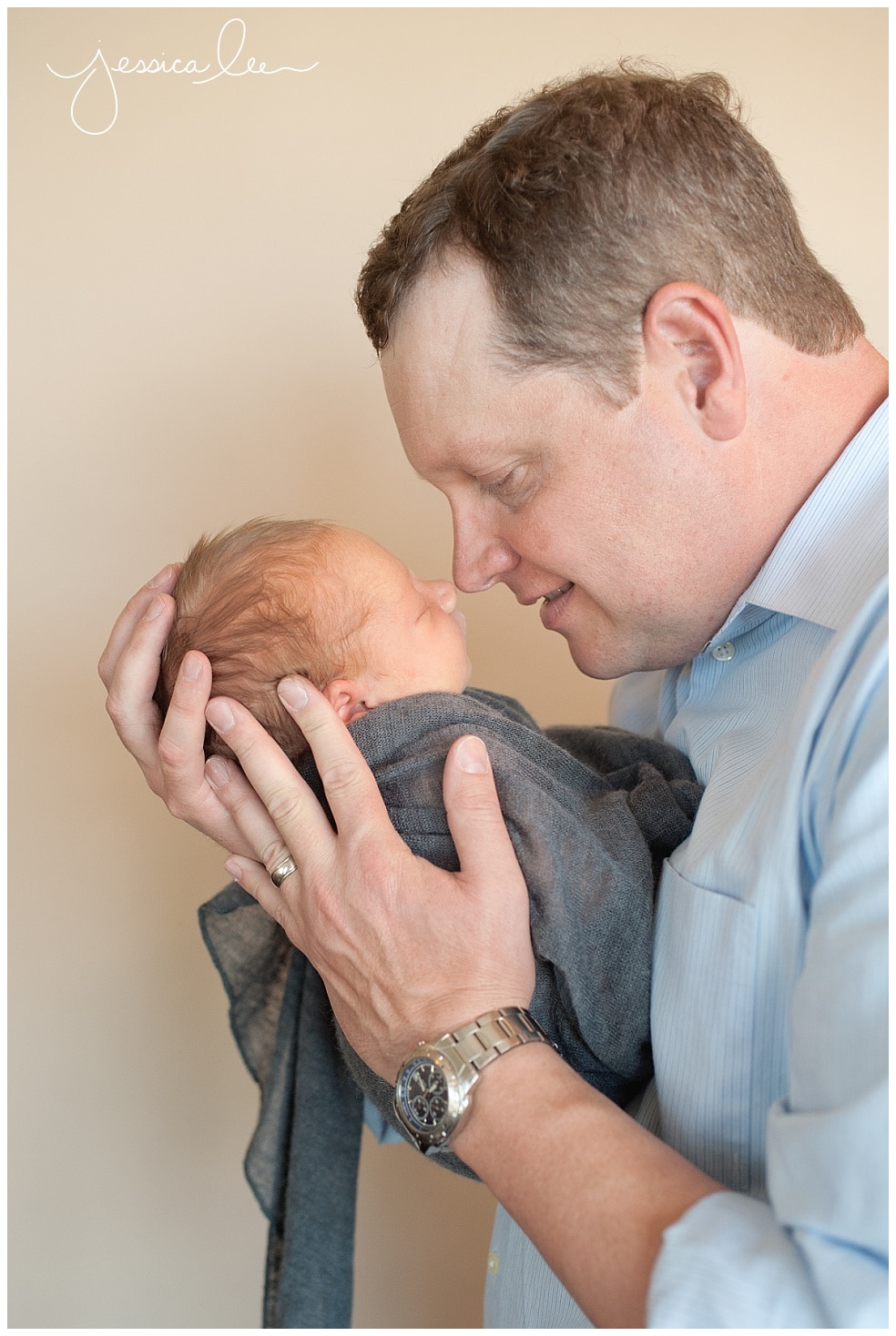 newborn photographer broomfield, dad nose to nose with newborn
