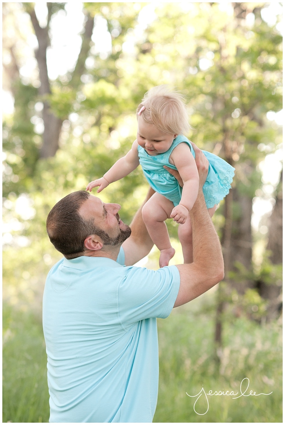Family Photographer Broomfield, dad holding daughter up in air