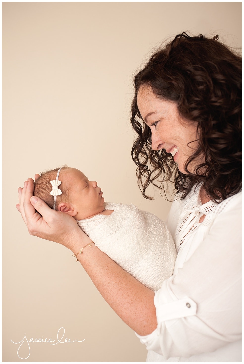 Baby Photography Boulder, mother smiling down at newborn baby