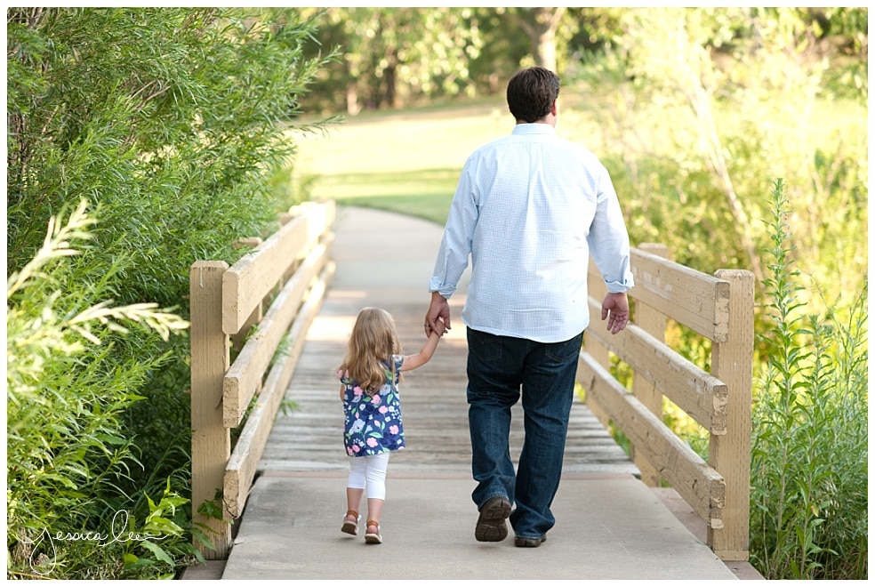 family photographer longmont, dad and daughter walking together