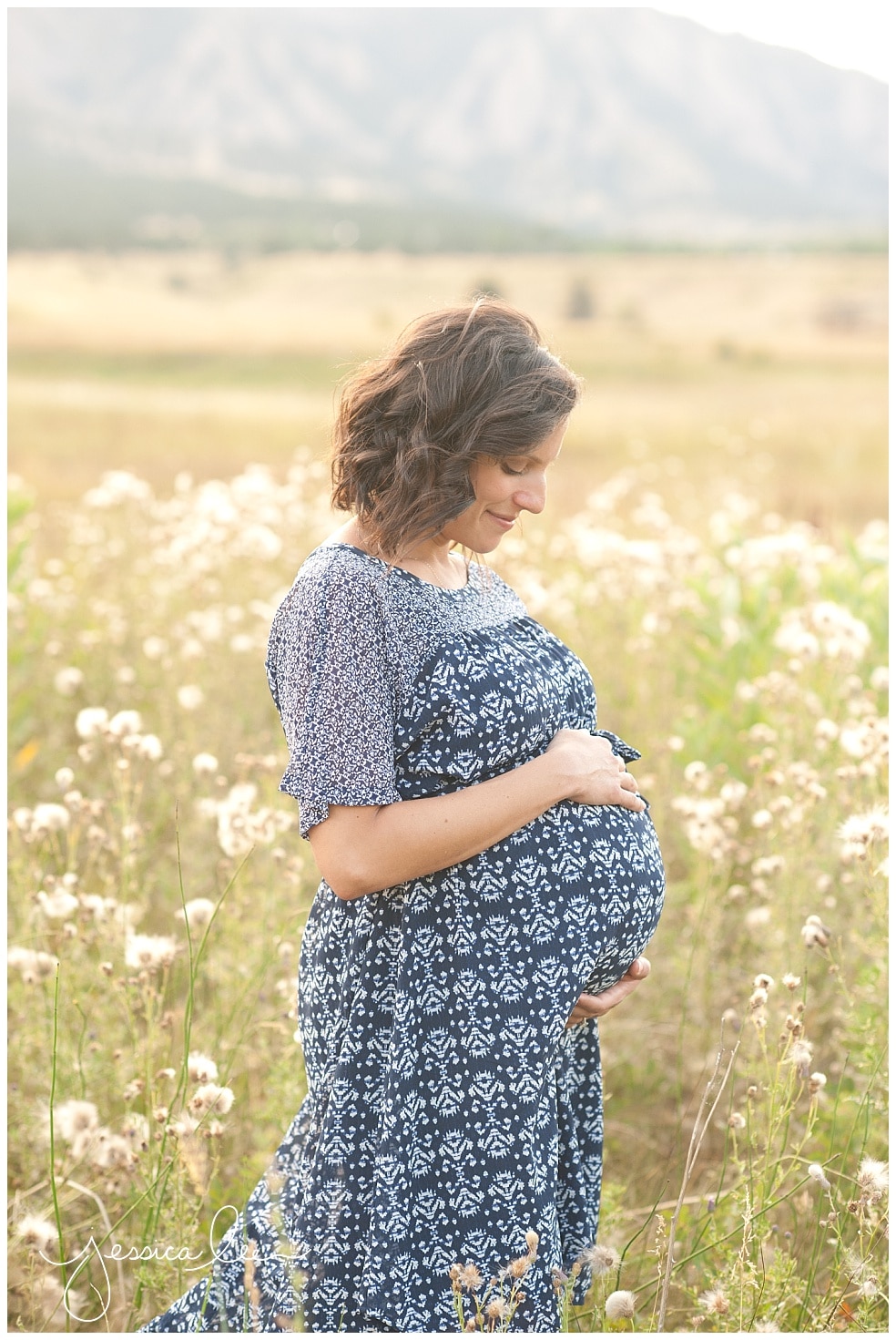 Boulder maternity photographer, mother in field of flowers