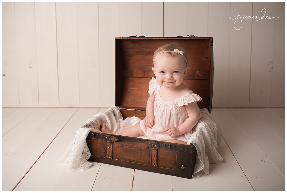 baby smiling in light pink outfit it suit case, Baby Photography Broomfield 