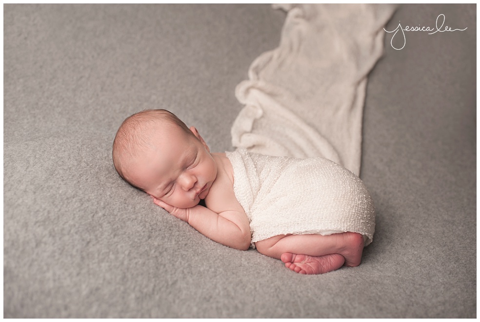 baby sleeping on belly with white wrap, denver colorado photography