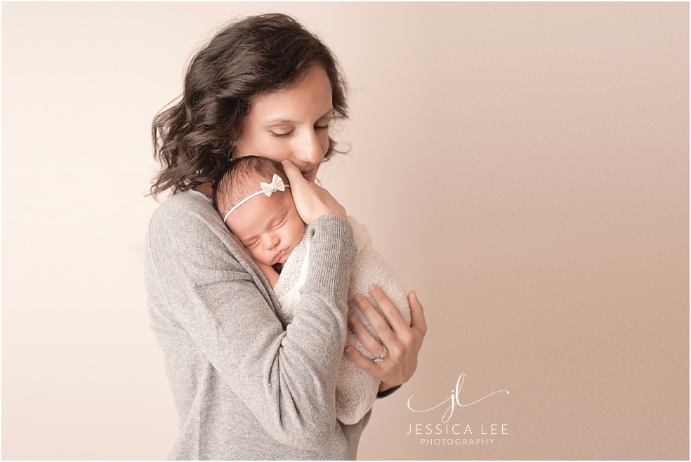 Baby Photographer Boulder, mother snuggling with newborn baby