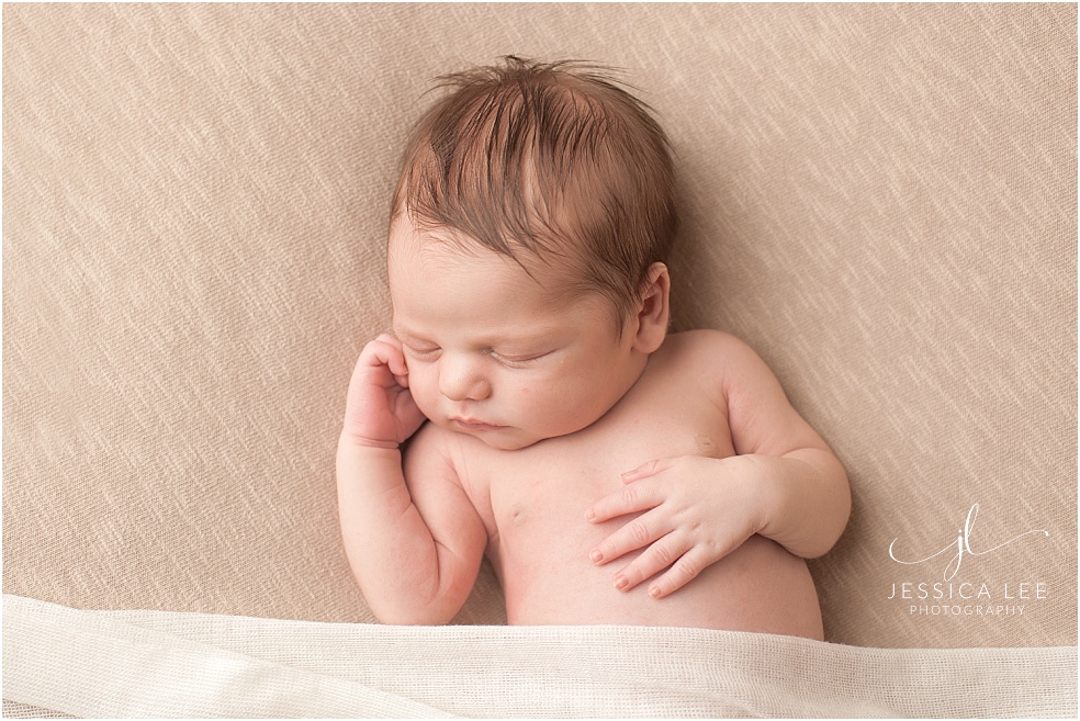 Baby Photographer Boulder, baby on tan blanket