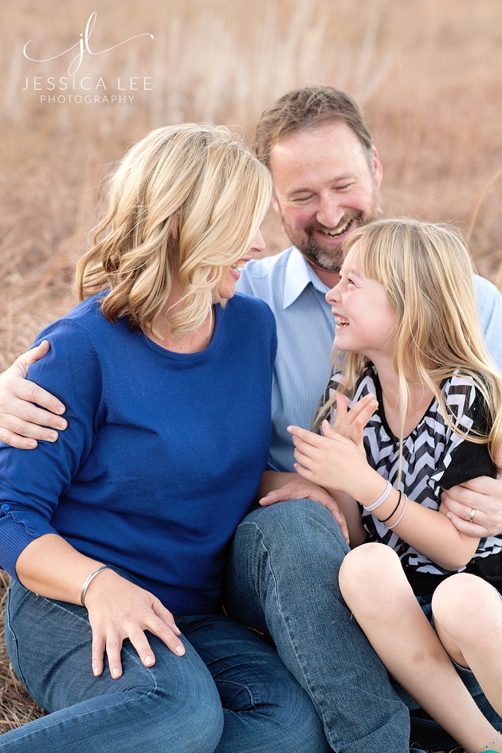 Longmont Family Photographer, family of 3 laughing together