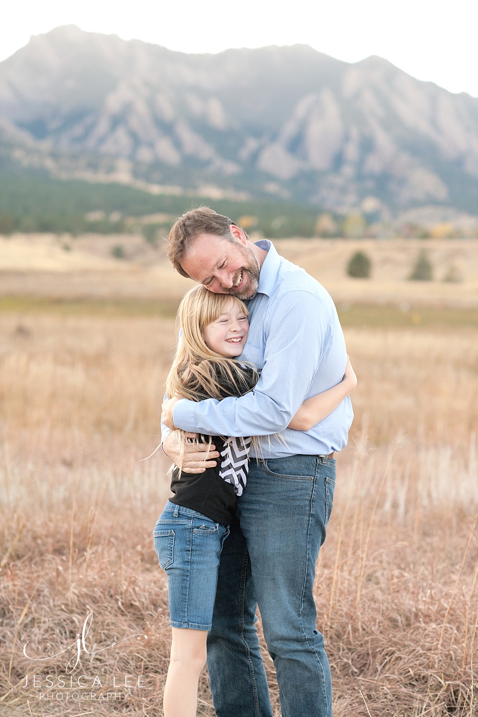 Longmont Family Photographer, daughter hugging dad
