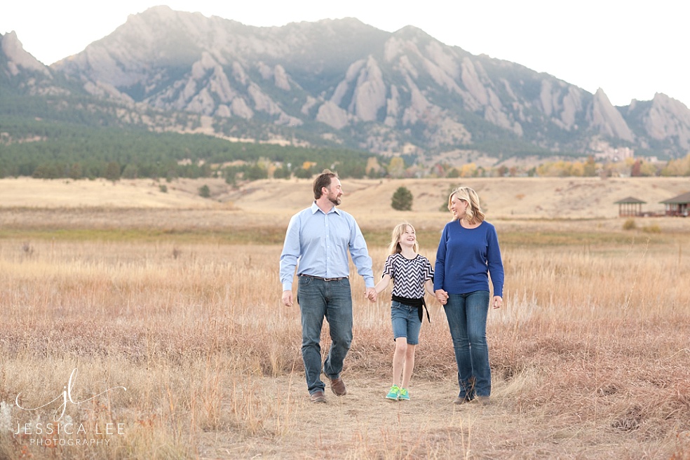 Longmont Family Photographer, family walking in front of mountains