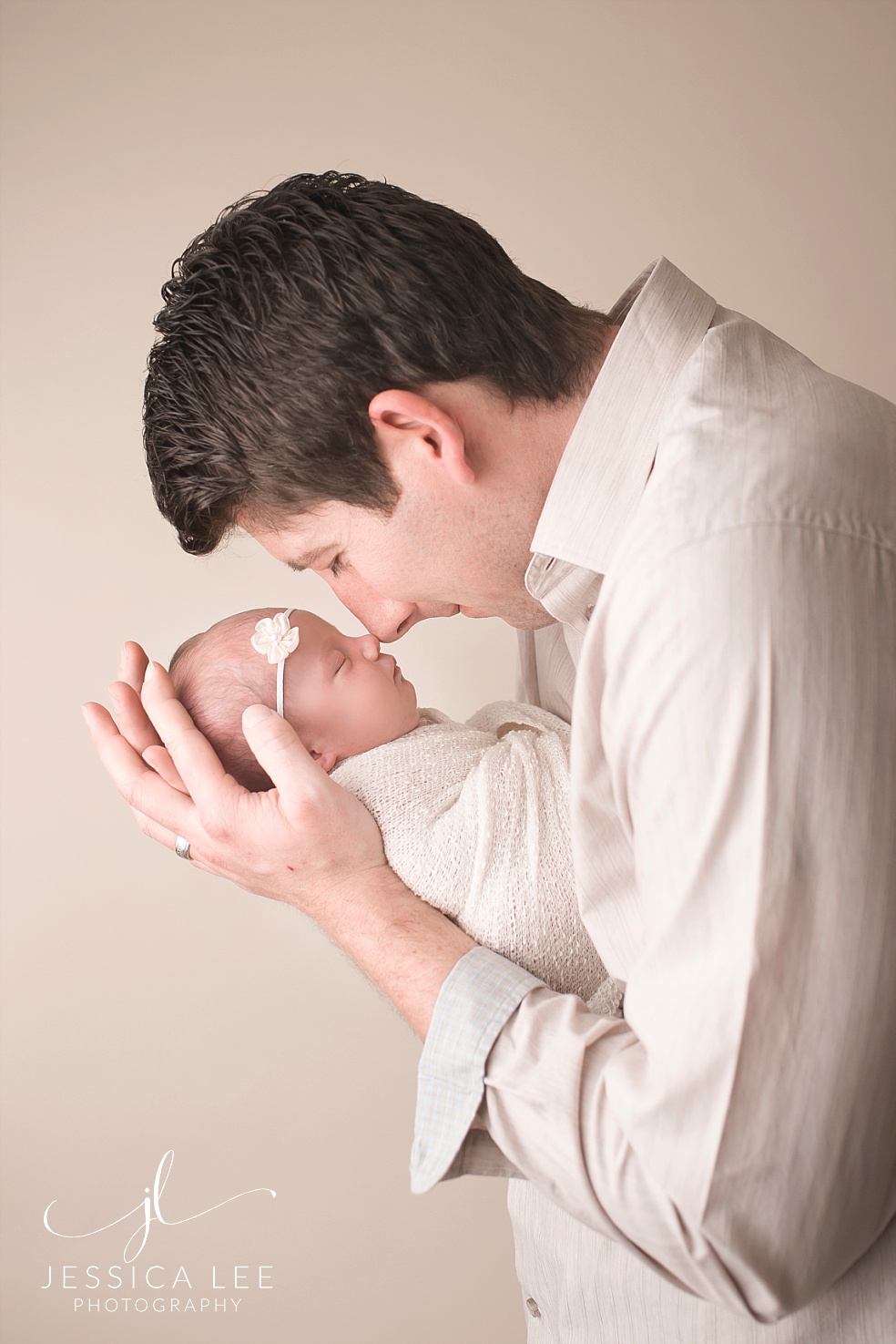 Broomfield Colorado Newborn Photographer, dad snuggling nose to nose with baby