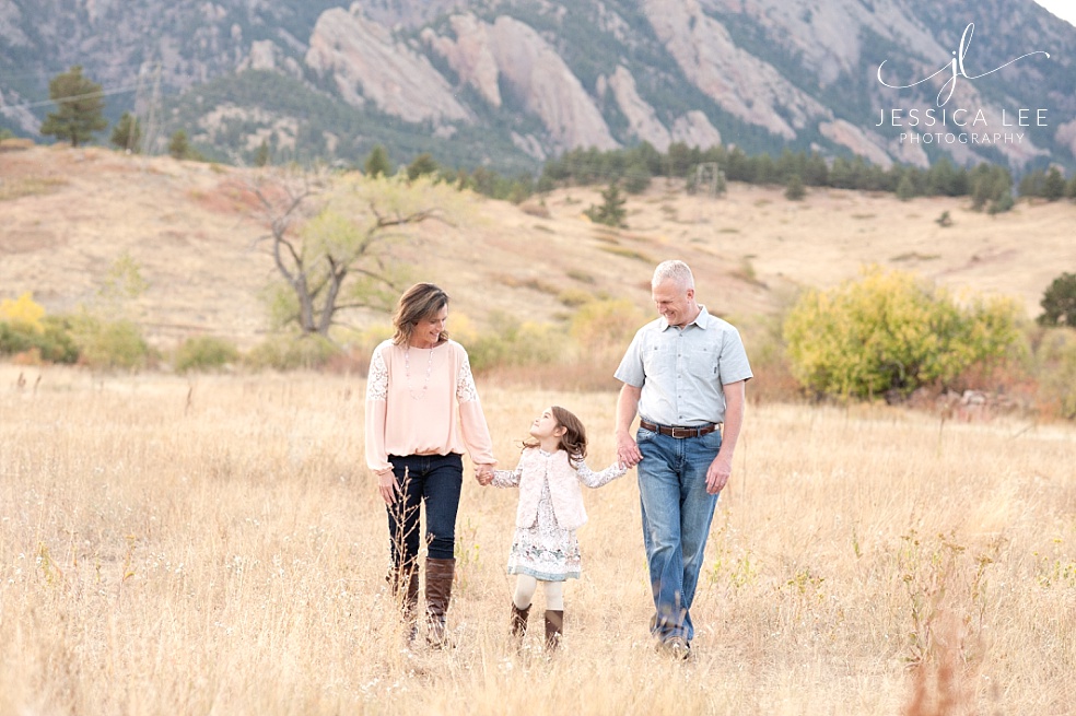 Broomfield Colorado Family Photographer, family walking together in front of mountains