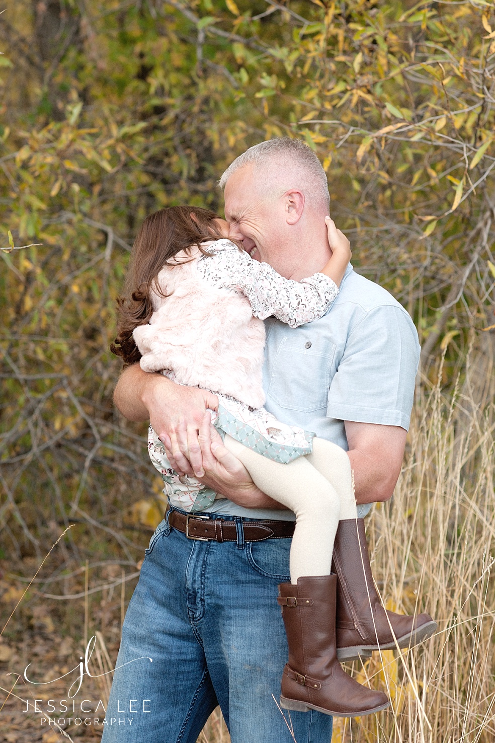 Broomfield Colorado Family Photographer, dad and daughter giggling together