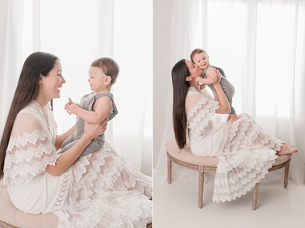 Mom in white dress playing patty cake with toddler baby | Photo by Jessica Lee Photography