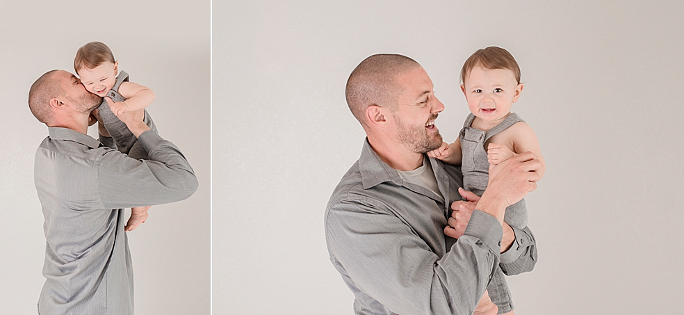 Dad and baby boy in gray playing airplane | Photo by Huntsville Baby Photographer Jessica Lee 