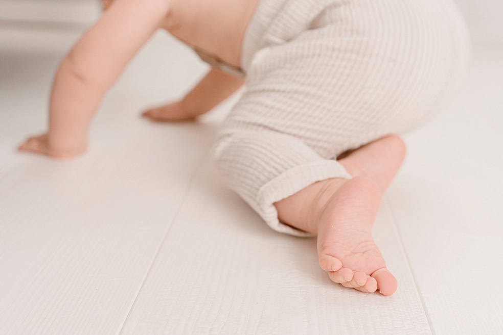Detail photo of baby boys foot as he's crawling away | Photo by Huntsville Baby Photographer Jessica Lee 