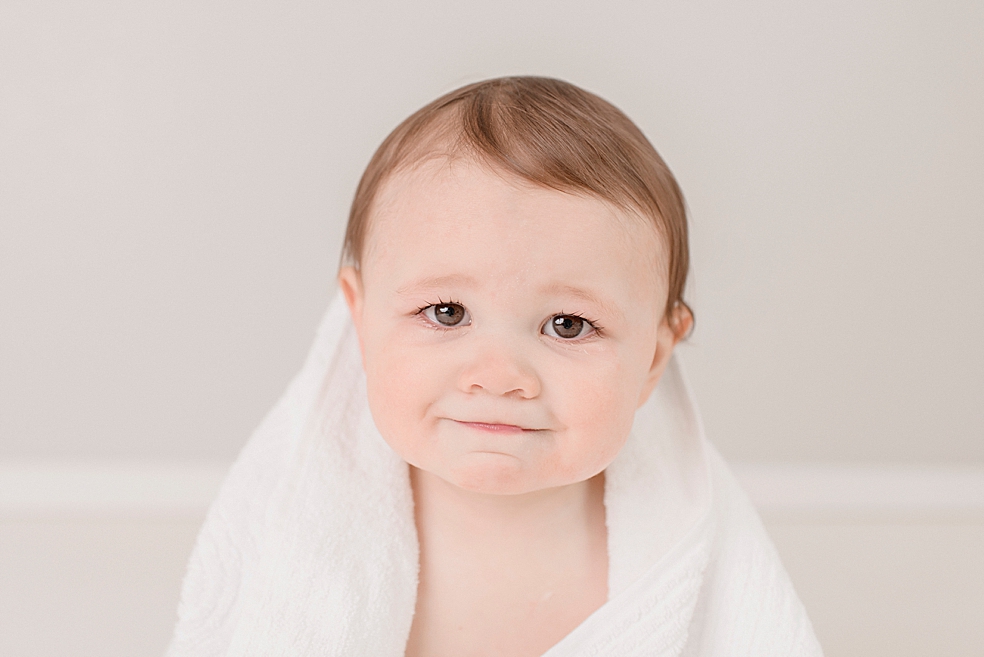 Baby boy wrapped in white towel | Photo by Huntsville Baby Photographer Jessica Lee 