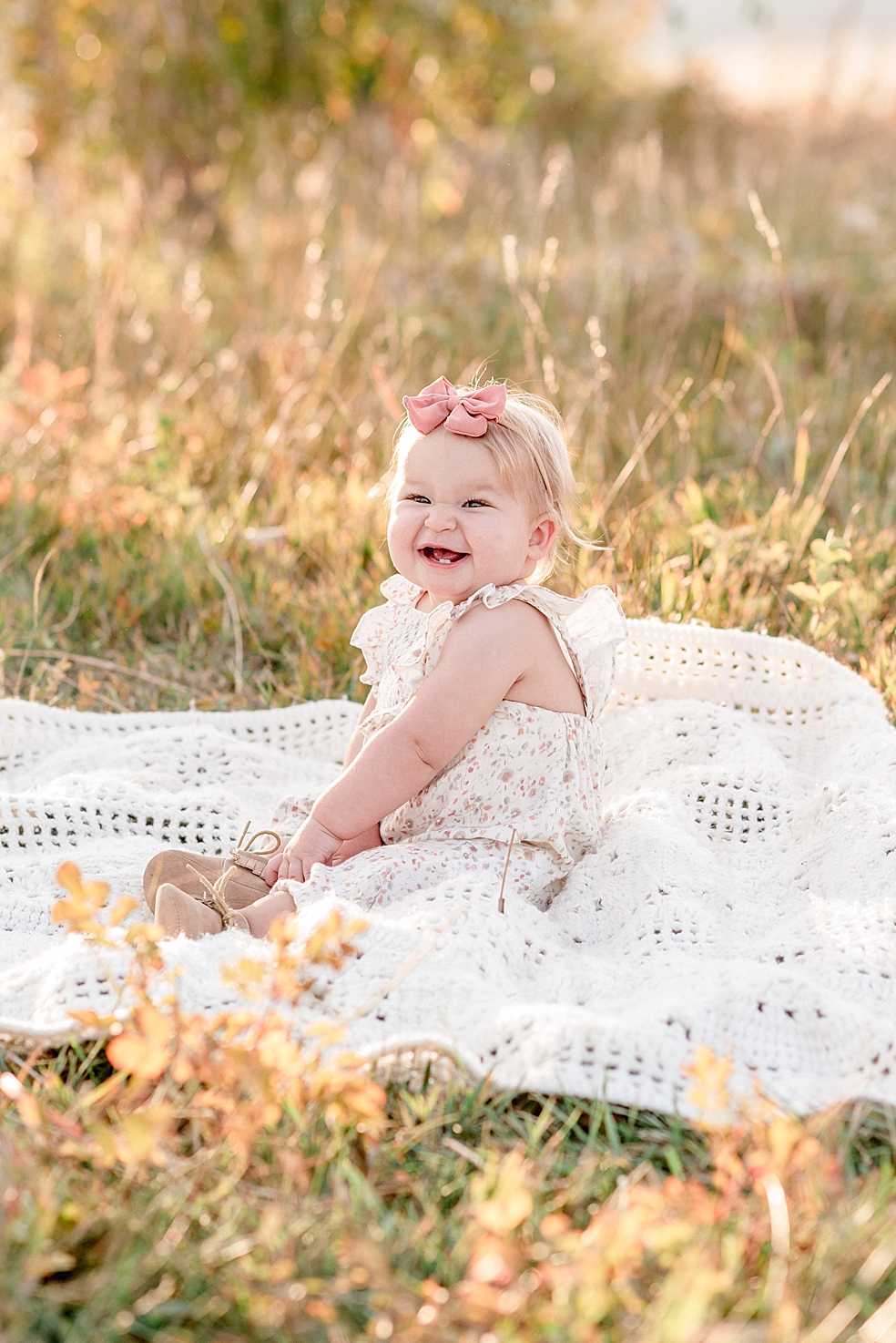 Toddler baby girl scrunching nose and smiling | Photo by Jessica Lee Photography