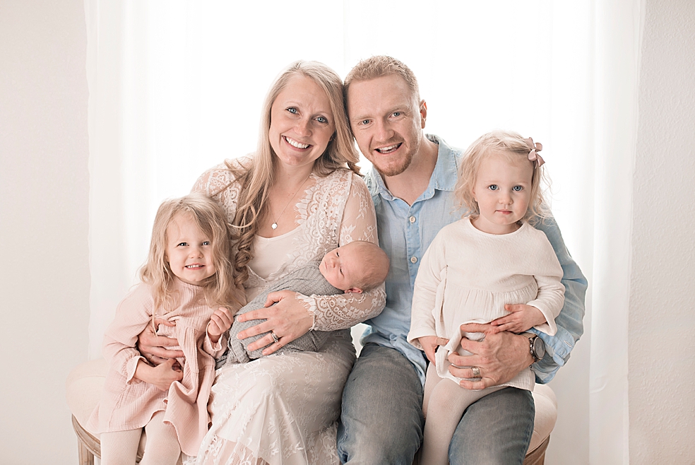 Family in neutrals and blue in studio session | Photo by Jessica Lee Photography