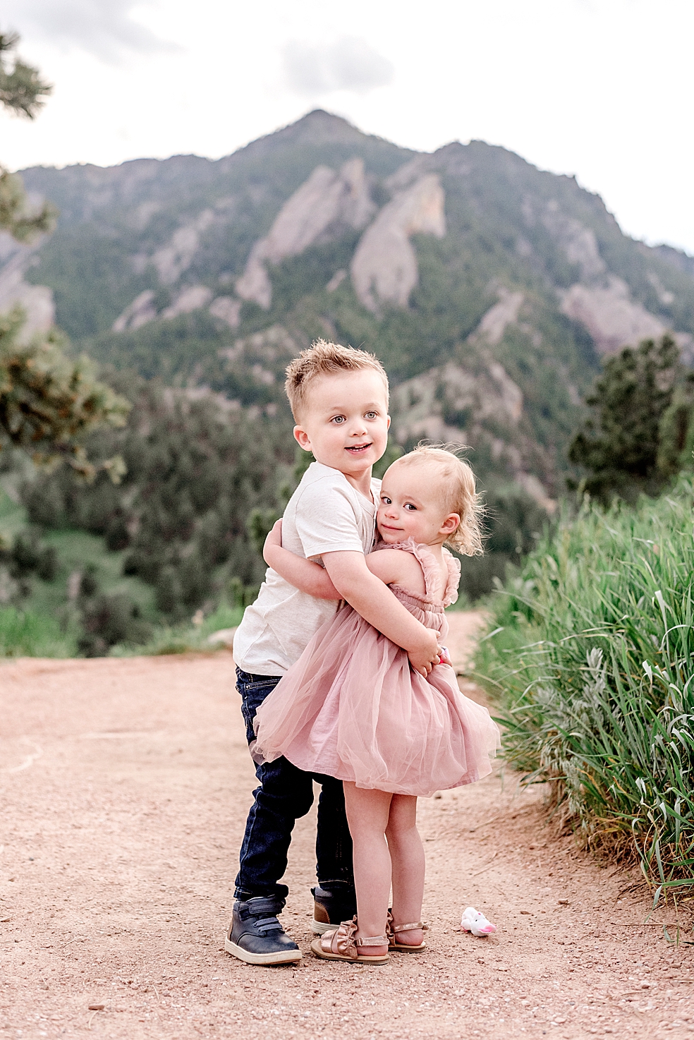 Little brother hugging sister in pink dress | Photo by Decatur Alabama Family Photographer Jessica Lee