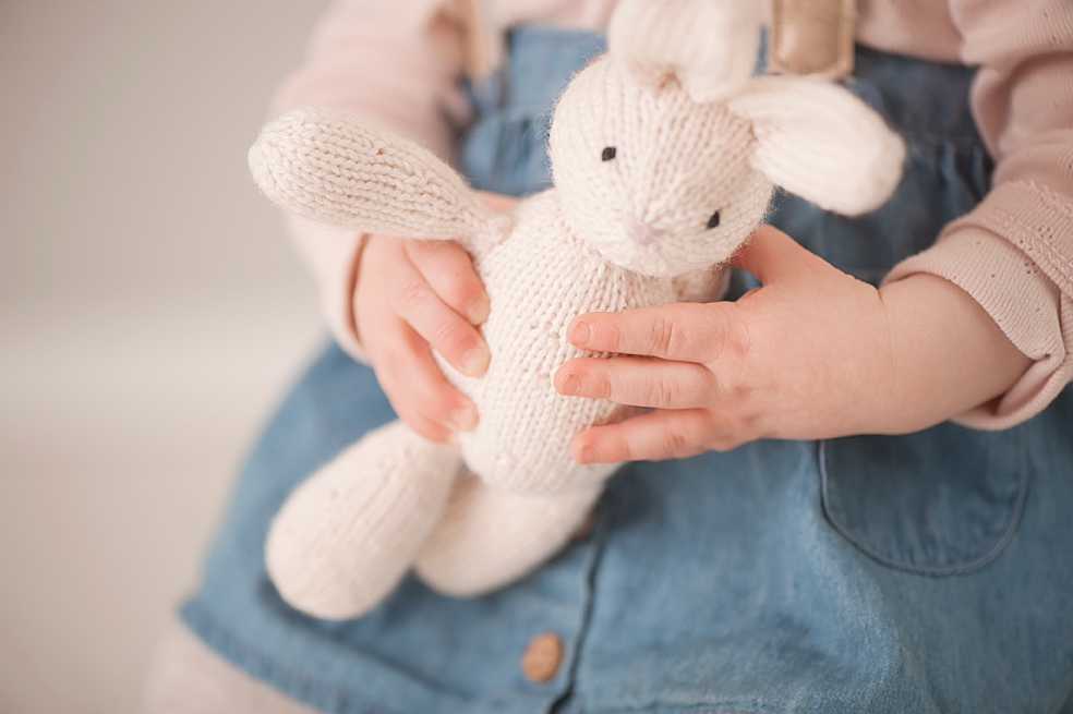 Ting hands holding a stuffed bunny | Photo by Jessica Lee Photography 
