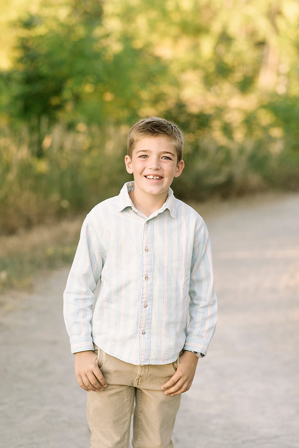 Young boy smiling in blue button down | Photo by Jessica Lee Photography 