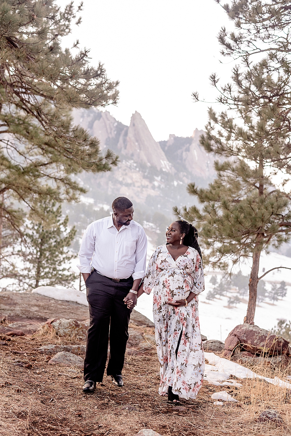 Mom and dad to be walking together holding hands | Photo by Huntsville Motherhood Photographer Jessica Lee Photography