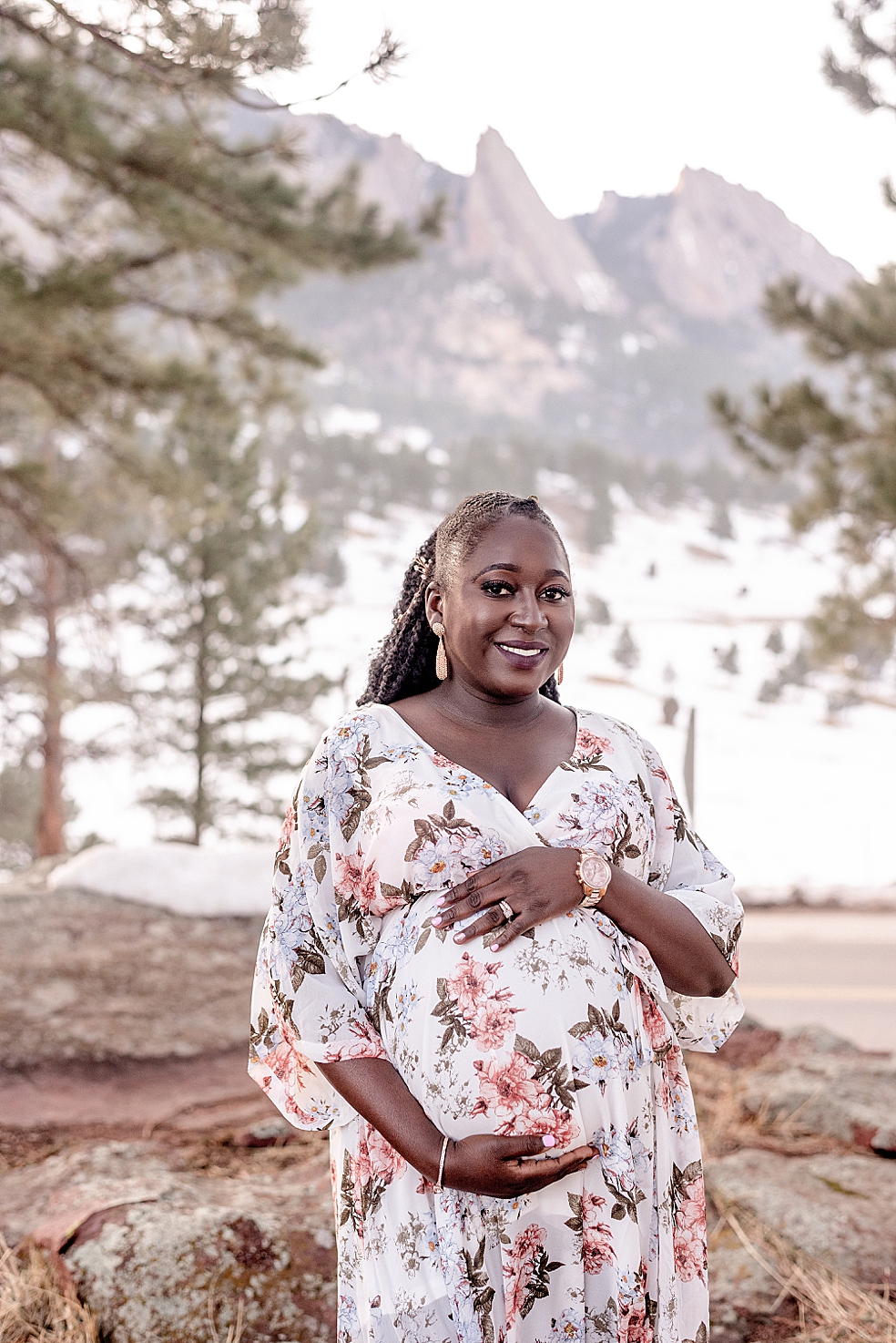 Mom to be in floral dress smiling | Photo by Huntsville Motherhood Photographer Jessica Lee Photography