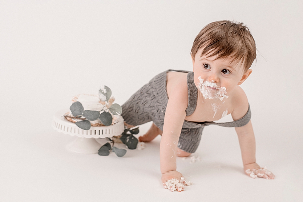 Baby boy with icing crawling | Photo by Jessica Lee Photography