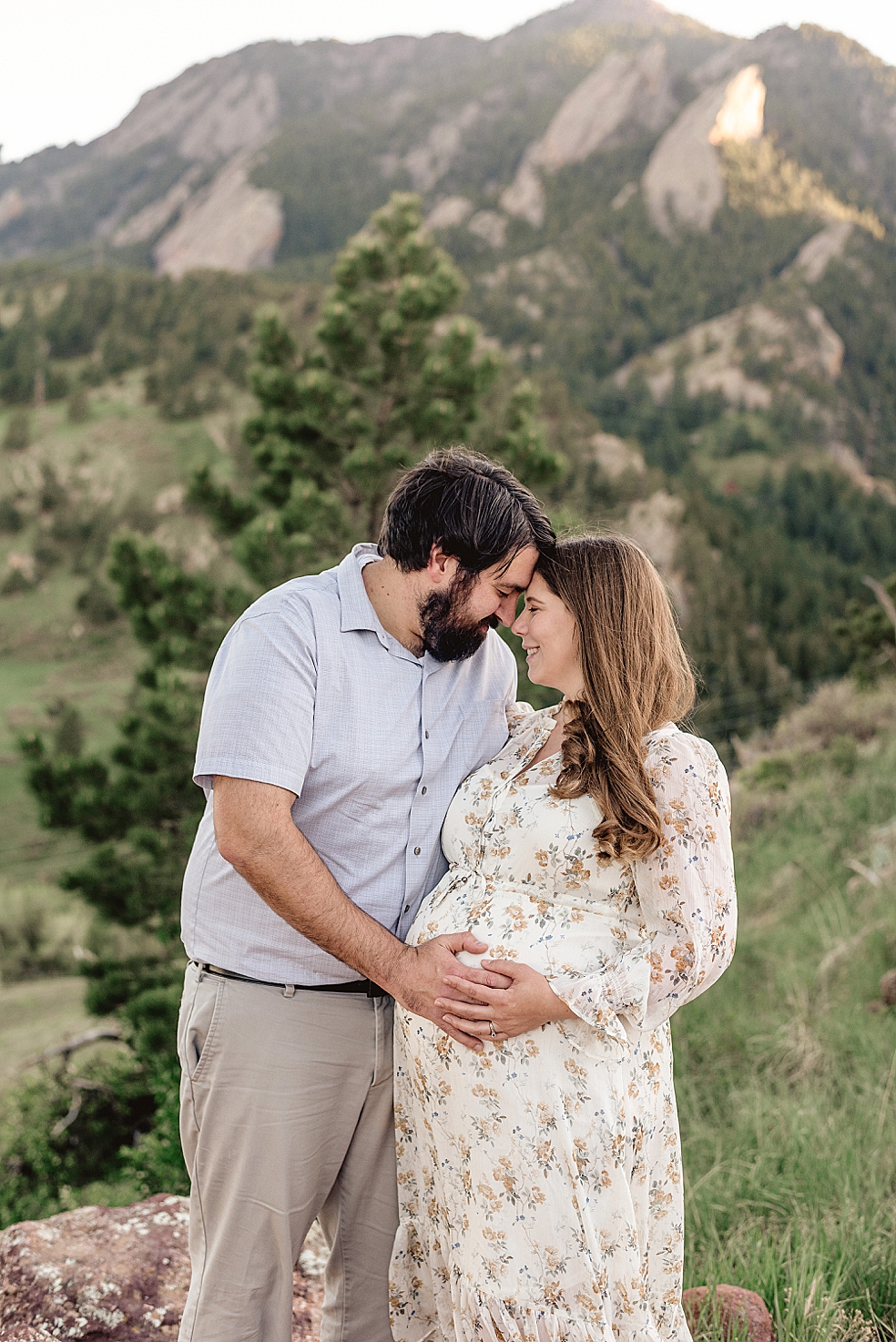 Mom and dad to be with their foreheads together | Photo by Meridianville Maternity Photographer Jessica Lee