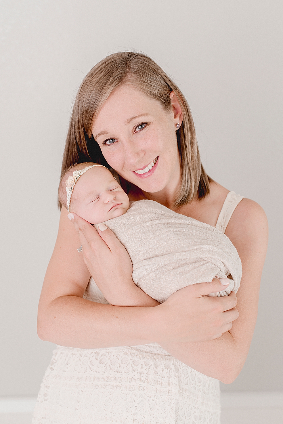 Mom snuggling with her newborn baby girl | Studio Newborn Session with Jessica Lee Photography