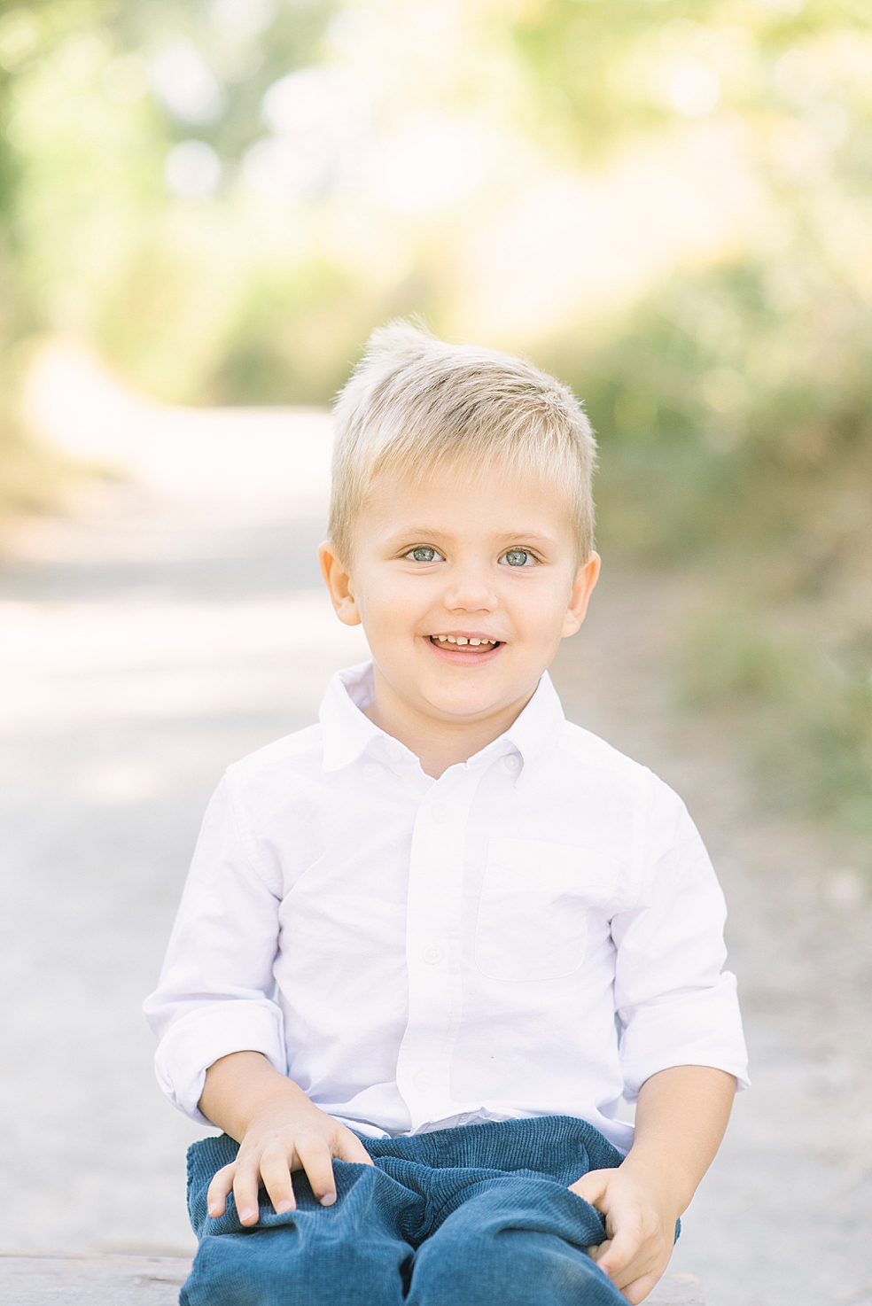 Little boy in blue and white smiling | Photo by Jessica Lee Photography