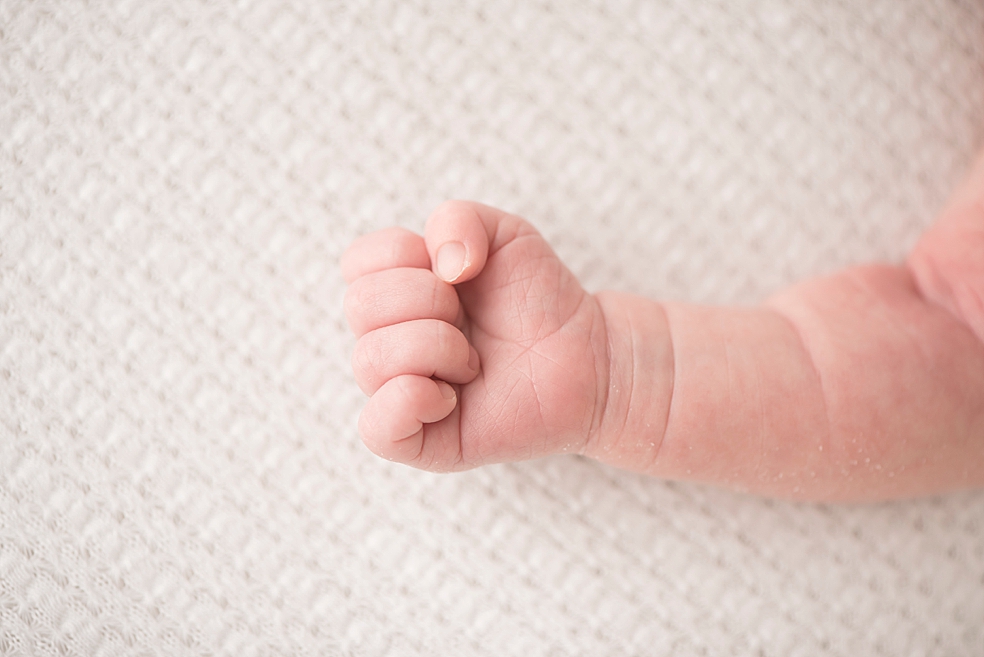 Baby girl's tiny hand | Photo by In-Home Huntsville Newborn Photographer Jessica Lee 