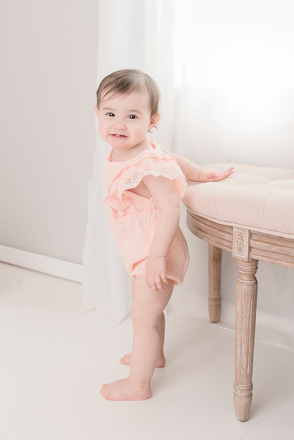 Baby girl in pink during her light and airy studio session | Photo by Jessica Lee Photography