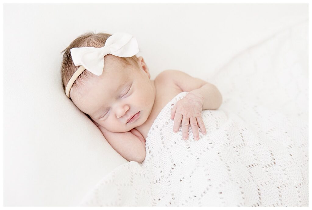 Jessica Lee Photography - Newborn posed on white blanket